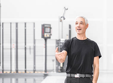 A mechatronics engineer with a wrench